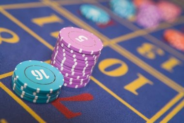 Live Sic Bo dealer studio at live sd with three dice, betting interface visible on mobile phone screen
